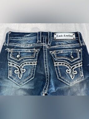 25 Rock Revival Low-Rise Kai Bootcut Distressed Blue Embellished Pocket Jeans